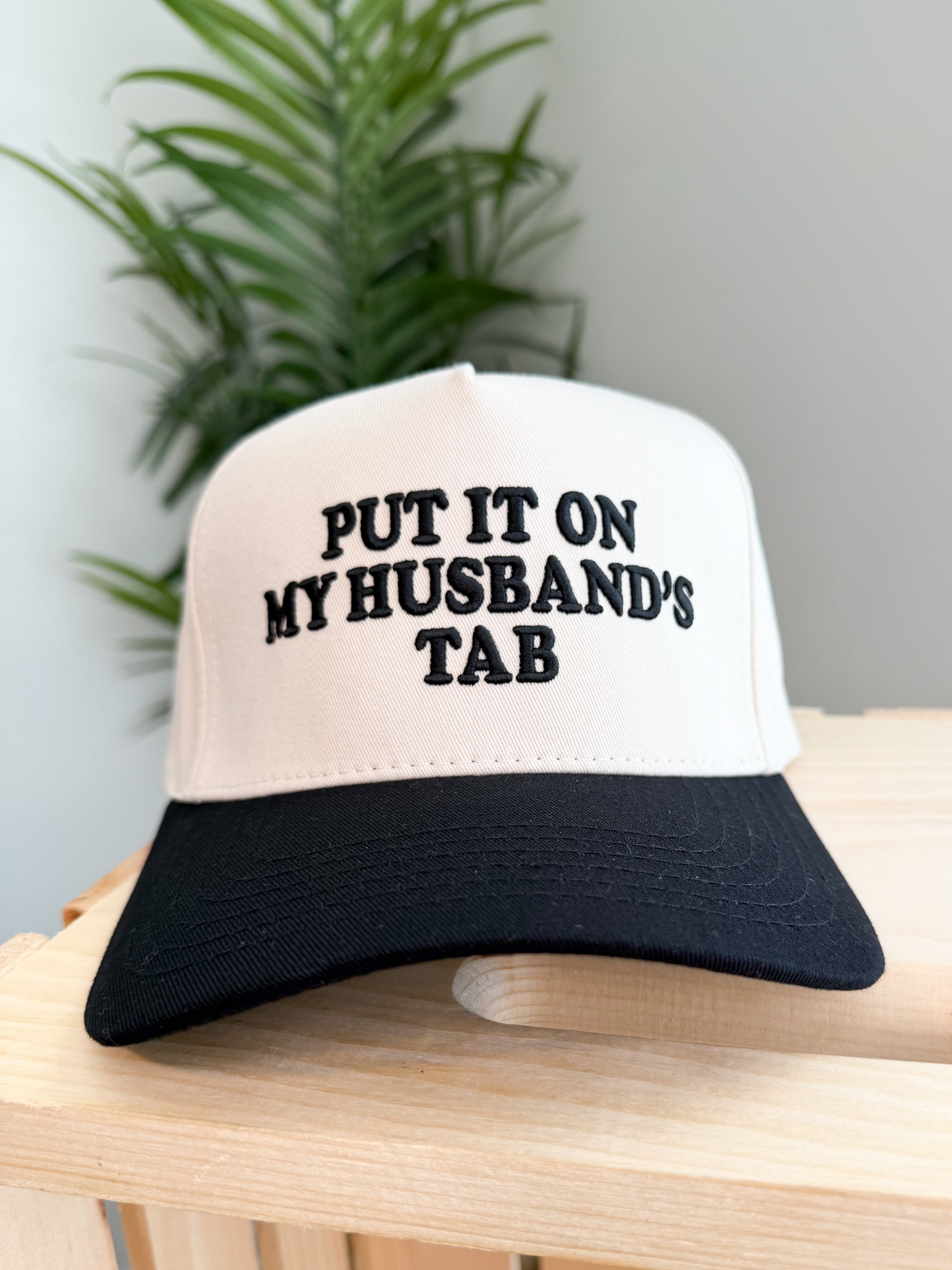 PUT IT ON MY HUSBAND'S TAB Letter Trucker Hat
